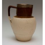 A large early nineteenth century saltglazed stoneware Turner jug with hallmarked silver rim, circa