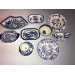 A collection of early nineteenth century blue and white transfer printed wares including stands, a