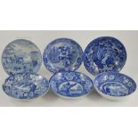 A collection of six early nineteenth century blue and white transfer printed saucers printed with