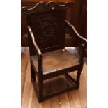 A William and Mary oak wainscot chair, circa 1695, scrolled top above a floral carved panel,