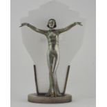 A 1930's Art Deco cold painted spelter table lamp, as a fashionable lady with arms outstretched,