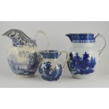 Three early nineteenth century blue and white transfer printed jugs, circa 1800-1830. Two are