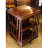 An Edwardian mahogany and satinwood lined revolving bookcase, circa 1905, near-square crossbanded