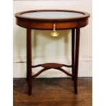 An Edwardian mahogany bijouterie, circa 1910, oval top with glazed inlay enclosing interior,