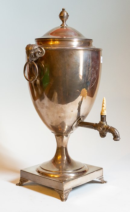 A George III Sterling silver tea urn, London 1790, makers mark for James Young, rams head handles,