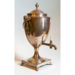 A George III Sterling silver tea urn, London 1790, makers mark for James Young, rams head handles,