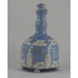 An interesting early nineteenth century blue glazed and sprig moulded dedicated flask on feet, circa
