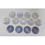 A group of early nineteenth century blue and white transfer printed eel plates or cockle plates,