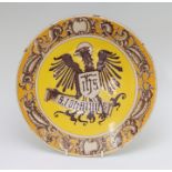 A late nineteenth century Maiolica wall plaque, circa 1880. It is decorated with an eagle holding