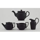 A group of mainly early nineteenth century black basalt wares, circa 1820-30. Comprising: Two