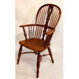 An early 19th century elm and yew low back Windsor chair, circa 1810, sparred back centred with