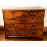 A George III mahogany chest of drawers, circa 1800, rectangular moulded edge top above two short and