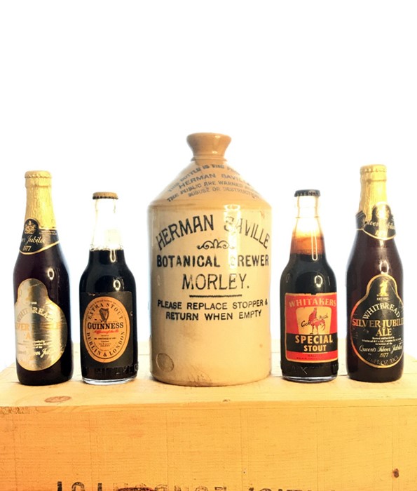 A collection of Breweriana items along with commemorative bottles.