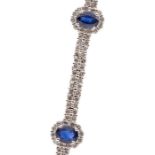 A sapphire and diamond 18ct white gold bracelet, comprising five oval cut sapphires, total
