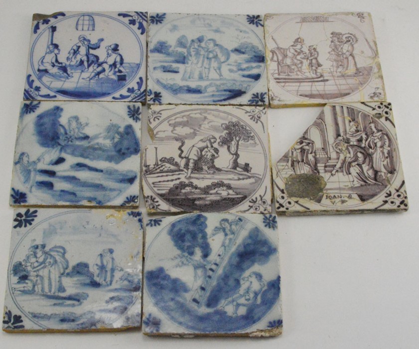 A group of four eighteenth century Bristol tin-glazed delftware blue and white hand painted tiles,