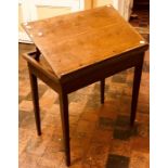 A George III mahogany folding architect’s table, circa 1780, three frieze drawers on tapered