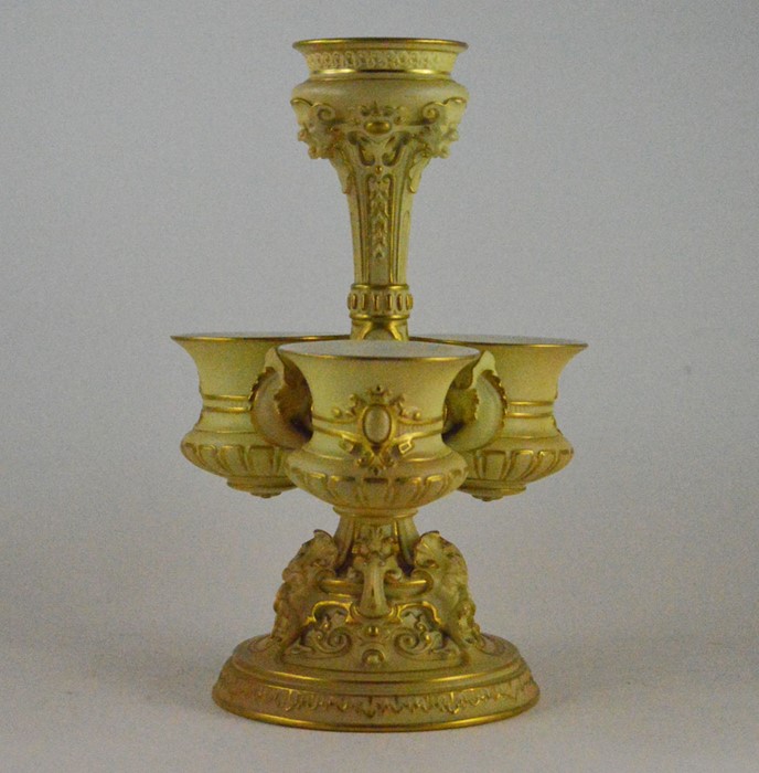 A Royal Worcester blush ivory table centrepiece, early 20th Century, with a central column and