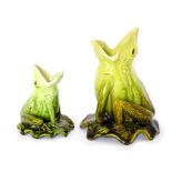 Two Bretby art pottery green glazed vases modelled as frogs sitting upon a lily leaf. Both unmarked.