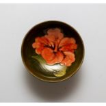 A Moorcroft hibiscus low bowl, Queen Mary paper label, diameter 14cm