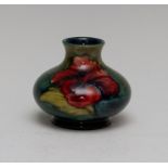 A Moorcroft hibiscus low vase, Queen Mary paper label, height 8cm