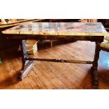 A mid 19th century rosewood and later marble top table, rectangular top on carved trestle ends