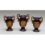 An early nineteenth century Masons ironstone garniture set, circa 1815. Each vase is decorated in