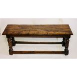 A George I oak stool, circa 1730,  moulded rectangular top, above a carved turn reed supports on