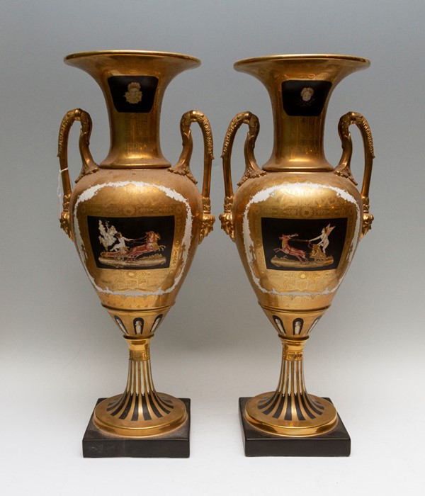 A large pair of 20th Century hard paste twin handled baluster vases of Empire design, extensive