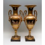 A large pair of 20th Century hard paste twin handled baluster vases of Empire design, extensive