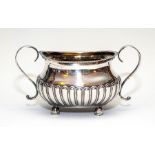 A George III silver stop-fluted bombe twin handled sugar basin, maker Soloman Hougham, London
