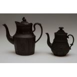 Two early nineteenth century black basalt coffeepots and covers, circa 1810-1820. Both are decorated
