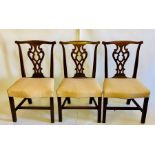A set of six harlequin mahogany dining chairs, each with pierced with a vertical splat to the
