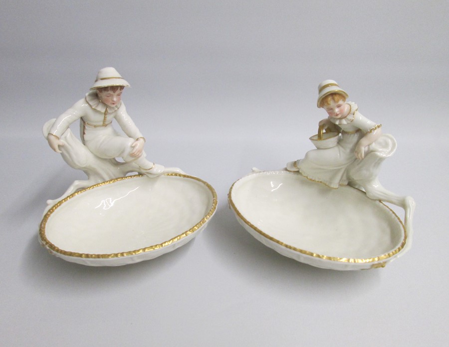 A pair of Fine Royal Worcester Figural Comports depicting a Boy and a Girl in  a Hadley style