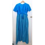 A Ricci Michael's of Mayfair c1960’S blue and lurex taffeta evening dress empire line; A 1970’s Mary