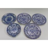 A collection of early nineteenth century blue and white transfer printed Basket of Flowers wares,