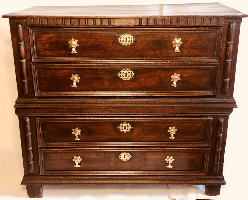 A late 17th Century oak chest of drawers in two sections, circa 1690, rectangular top, dentil