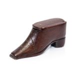 A mid 19th Century treen shoe snuff box, inlaid brass tack, metal heal and toe cap, sliding cover,