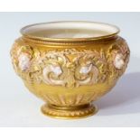 A Royal Worcester jardinière, early 20th Century, heavily gilded with moulded lion masks, 17cm high