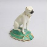 A Rockingham model of a seated Pug Dog  Date: circa 1790 Size: 5.5cm diameter, 6.5cm high
