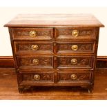 An 18th Century oak joined chest of drawers, rectangular top with moulded edge, above moulded