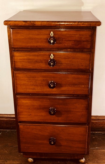 A mid 19th Century Victorian tall boy chest of drawers, circa 1850, rectangular form with five