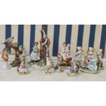 A collection of Capodimonte figures, comprising three musical cherubs, a figure group depicting a