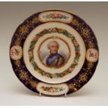 A mid-nineteenth century Sevres-style shaped circular porcelain plate, decorated with a portrait