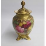 A Royal Worcester Vase and Cover standing on three Gilt feet and painted with Roses Un-signed