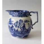 An early nineteenth century blue and white transfer printed sparrow-beak jug, circa 1810-1820. It is