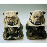 A pair of 19th century stone carved British bulldogs sitting on a cartouche shape platform. (2)