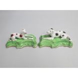 A Pair of English Porcelain Recumbent Pointer and Setter Dogs on green scroll bases  Date: circa