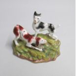 A Staffordshire Porcelain group of two Dogs on a grassy mound Date: circa 1850 Size: 11cm