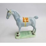 A Staffordshire or Yorkshire Model of a Horse standing four square on a green shaped base with an
