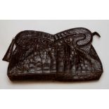 A Brown Crocodile Clutch bag in a large design, late 1940s with a metal zip disguised fastening. The